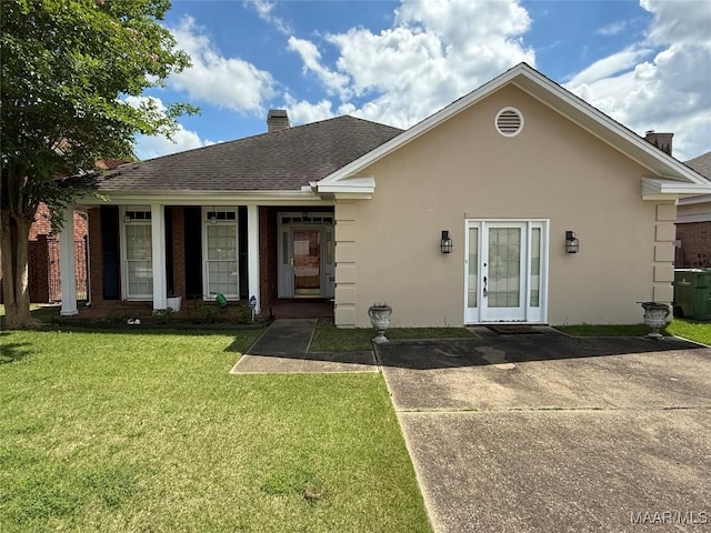 3504 Summerhill Dr, Montgomery, AL 36111 - rear view of property with a yard, a chimney, stucco siding, and a shingled roof