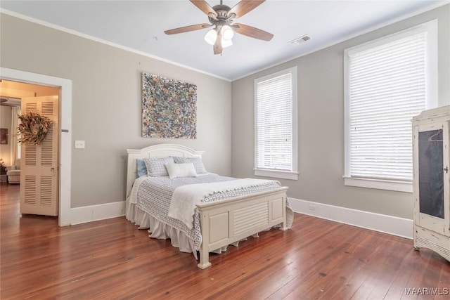231 E Main St, Prattville, AL 36067 - bedroom featuring wood-type flooring, crown molding, baseboards, and a ceiling fan