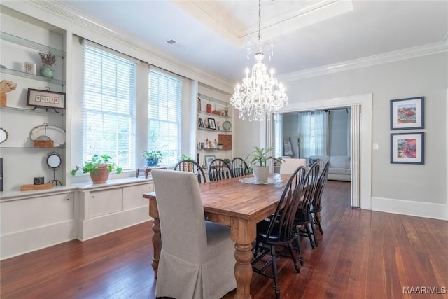 231 E Main St, Prattville, AL 36067 - dining room featuring dark wood-style floors, ornamental molding, a chandelier, and healthy amount of natural light