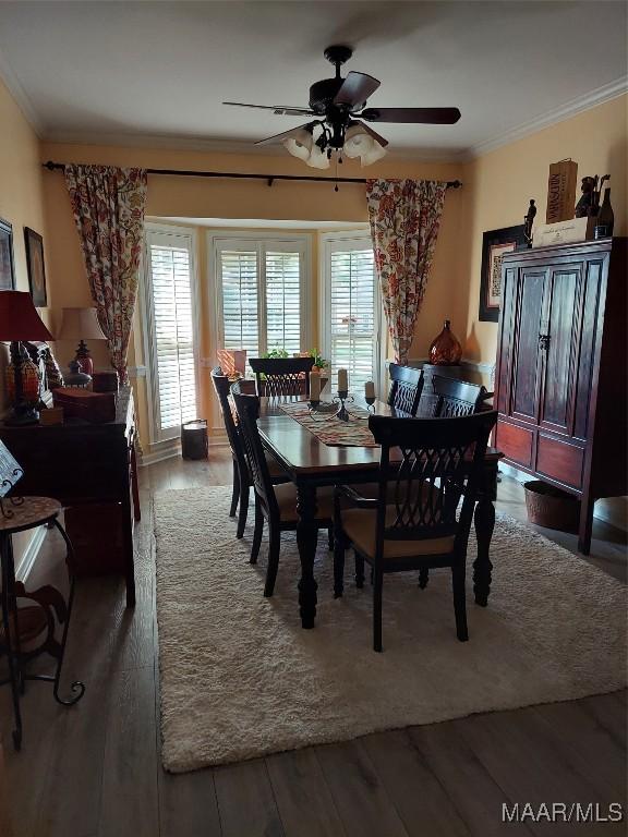 2564 Aimee Dr, Montgomery, AL 36106 - dining space with wood finished floors, crown molding, and a ceiling fan