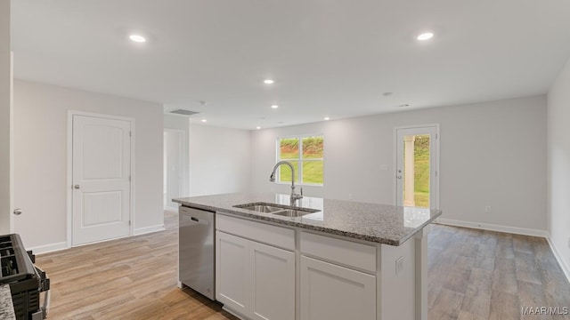 6004 Cunningham Trl, Montgomery, AL 36116 - kitchen with a sink, stainless steel dishwasher, light stone countertops, light wood finished floors, and recessed lighting