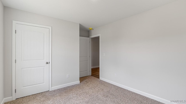 6004 Cunningham Trl, Montgomery, AL 36116 - unfurnished bedroom featuring baseboards and light carpet