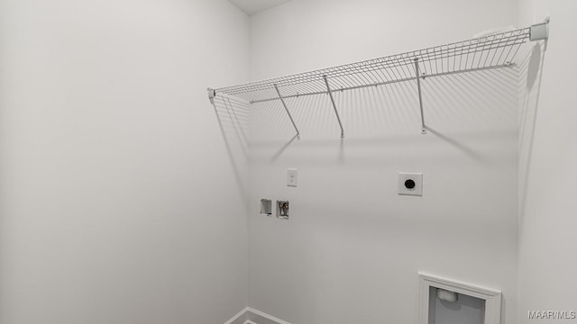 6004 Cunningham Trl, Montgomery, AL 36116 - clothes washing area featuring hookup for an electric dryer, hookup for a washing machine, and baseboards