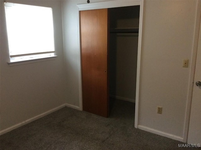 4037 Piedmont Dr, Montgomery, AL 36108 - unfurnished bedroom with a closet, carpet floors, and baseboards