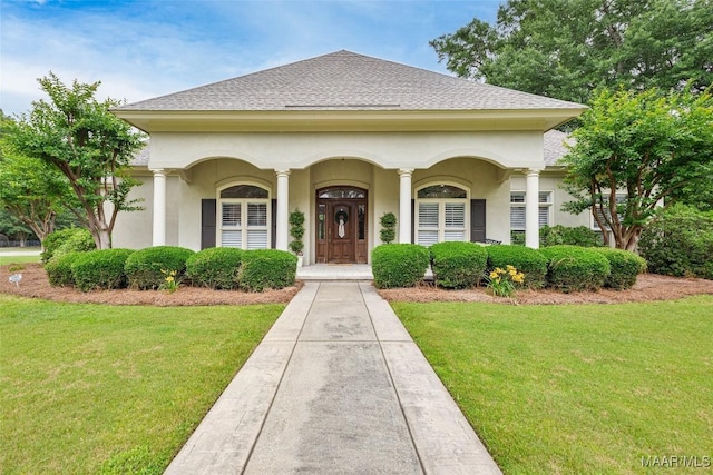8625 Wynford Pl, Montgomery, AL 36117 - view of front facade featuring a front yard, stucco siding, and a shingled roof