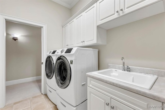 8625 Wynford Pl, Montgomery, AL 36117 - laundry area with washer and dryer, cabinet space, light tile patterned flooring, and crown molding