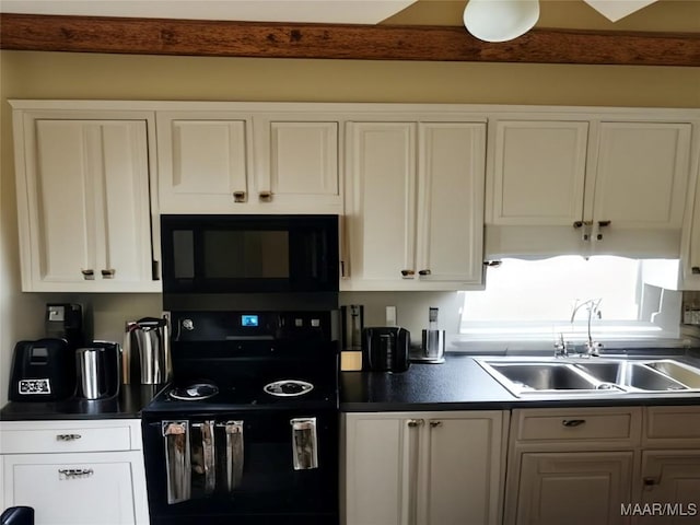 4804 Regal Dr, Montgomery, AL 36116 - kitchen featuring black appliances, a sink, dark countertops, and white cabinetry