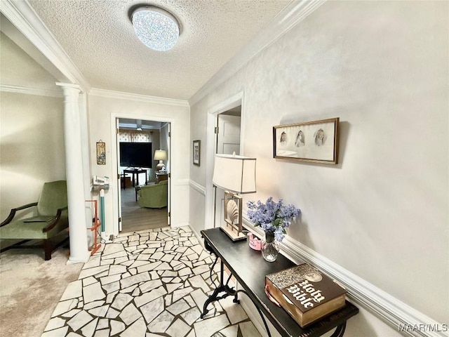 36 Wilkins Rd, Selma, AL 36701 - corridor with ornate columns, a textured ceiling, and crown molding