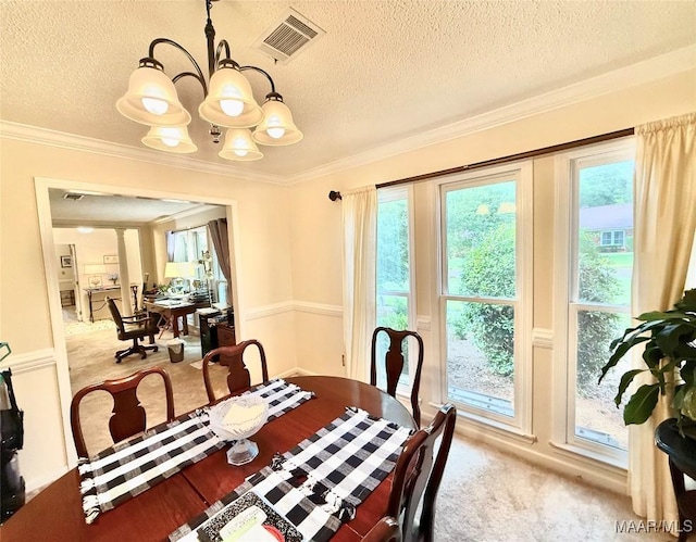 36 Wilkins Rd, Selma, AL 36701 - dining room with a textured ceiling, a chandelier, light carpet, and ornamental molding