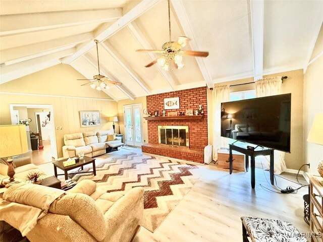 36 Wilkins Rd, Selma, AL 36701 - living room with a ceiling fan, wood finished floors, and a fireplace