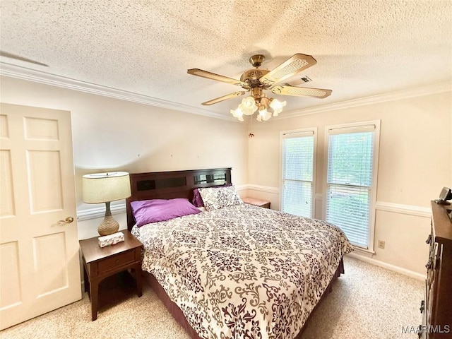36 Wilkins Rd, Selma, AL 36701 - bedroom featuring carpet floors, crown molding, a ceiling fan, a textured ceiling, and baseboards