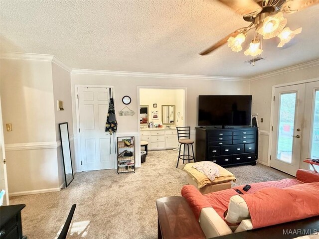 36 Wilkins Rd, Selma, AL 36701 - living area featuring light carpet, crown molding, a ceiling fan, french doors, and a textured ceiling