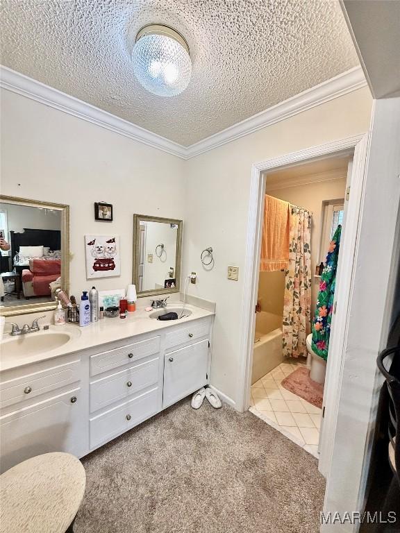 36 Wilkins Rd, Selma, AL 36701 - ensuite bathroom with crown molding, a textured ceiling, double vanity, shower / bath combination with curtain, and tile patterned flooring