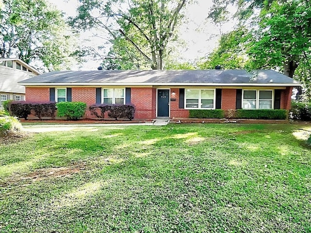 single story home featuring brick siding and a front yard