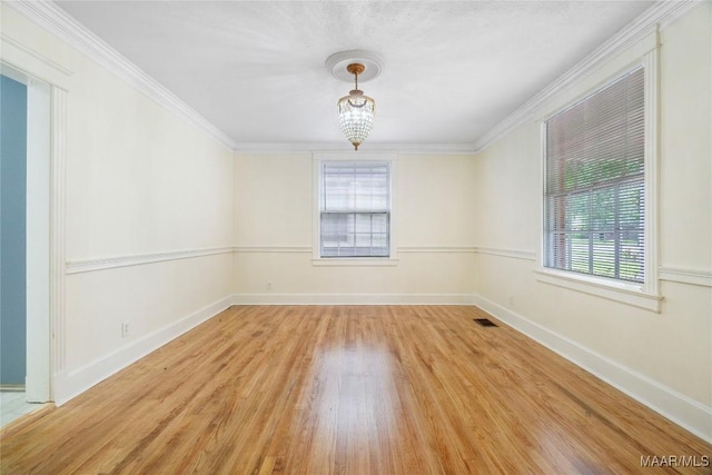 2046 Madison Ave, Montgomery, AL 36107 - empty room featuring healthy amount of natural light, wood finished floors, ornamental molding, and baseboards