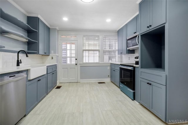2046 Madison Ave, Montgomery, AL 36107 - kitchen featuring dishwasher, range with electric cooktop, open shelves, crown molding, and decorative backsplash