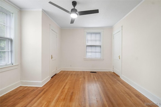 2046 Madison Ave, Montgomery, AL 36107 - unfurnished bedroom featuring light wood finished floors, ornamental molding, baseboards, and a ceiling fan