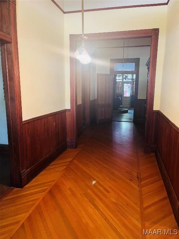 501 Tremont St, Selma, AL 36701 - corridor featuring wainscoting, wood finished floors, and wooden walls