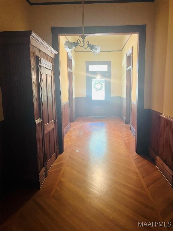 501 Tremont St, Selma, AL 36701 - corridor with a wainscoted wall and a chandelier