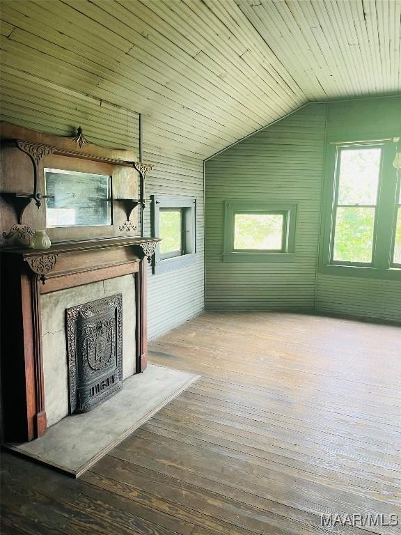 501 Tremont St, Selma, AL 36701 - unfurnished living room featuring wood-type flooring, a fireplace, lofted ceiling, and wood ceiling