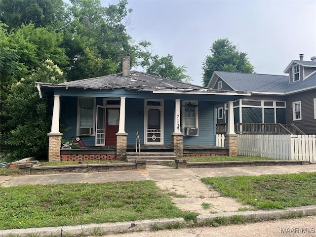 501 Tremont St, Selma, AL 36701 - view of front of house featuring covered porch, a chimney, and cooling unit