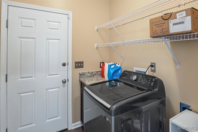 washroom with washer / clothes dryer