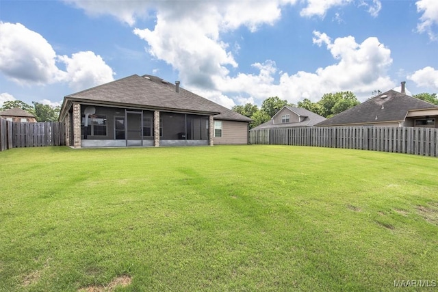 view of yard with a sunroom