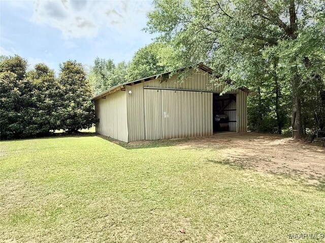 828 Warrior Dr, Valley Grande, AL 36701 - view of pole building with a yard