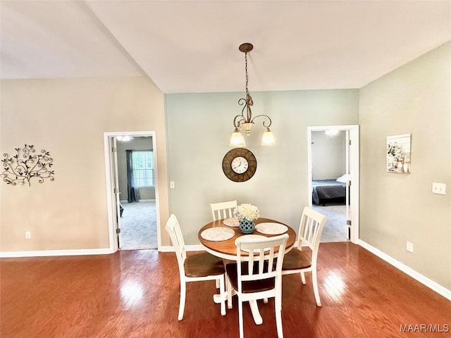 828 Warrior Dr, Valley Grande, AL 36701 - dining area with wood finished floors, baseboards, and a chandelier