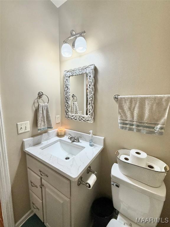 828 Warrior Dr, Valley Grande, AL 36701 - half bath featuring vanity and toilet