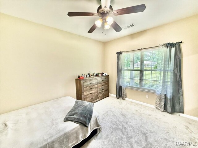828 Warrior Dr, Valley Grande, AL 36701 - carpeted bedroom featuring baseboards and a ceiling fan