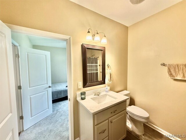 828 Warrior Dr, Valley Grande, AL 36701 - full bath featuring vanity, toilet, and baseboards