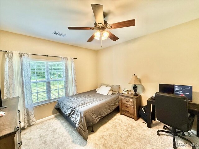 828 Warrior Dr, Valley Grande, AL 36701 - bedroom featuring light carpet, a ceiling fan, a desk, and baseboards
