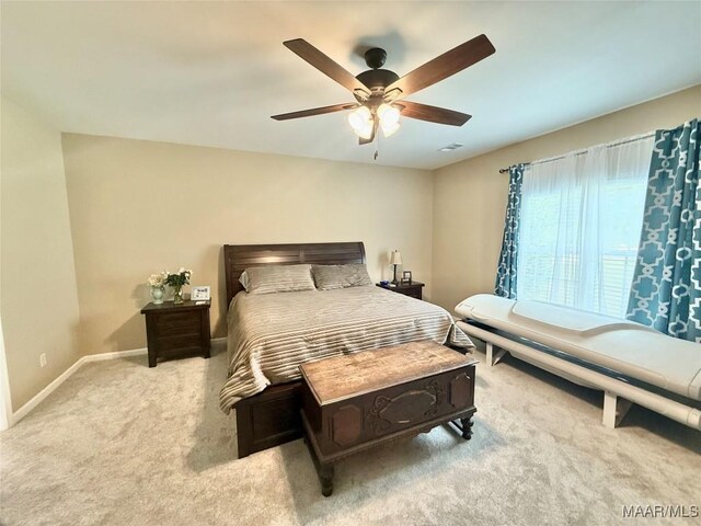 828 Warrior Dr, Valley Grande, AL 36701 - bedroom featuring light carpet, baseboards, and a ceiling fan
