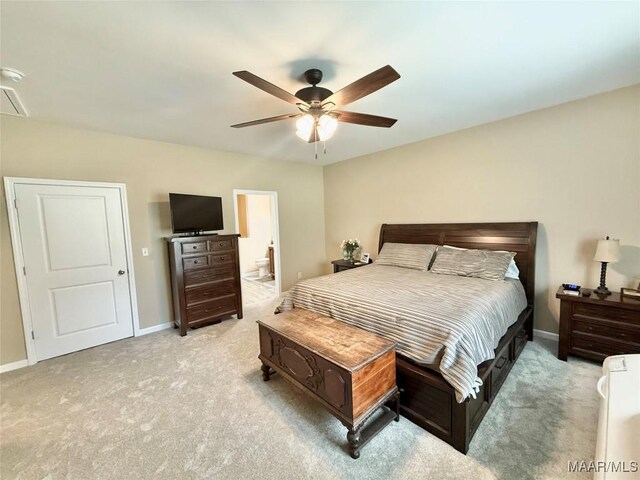 828 Warrior Dr, Valley Grande, AL 36701 - bedroom with light carpet, baseboards, ceiling fan, and ensuite bathroom