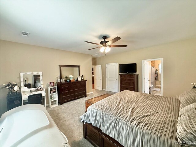 828 Warrior Dr, Valley Grande, AL 36701 - bedroom featuring light carpet, a ceiling fan, baseboards, and connected bathroom