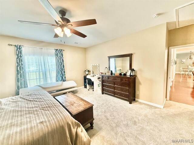 828 Warrior Dr, Valley Grande, AL 36701 - carpeted bedroom featuring baseboards, a ceiling fan, and attic access