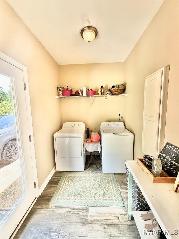828 Warrior Dr, Valley Grande, AL 36701 - laundry area featuring separate washer and dryer, wood finished floors, and baseboards