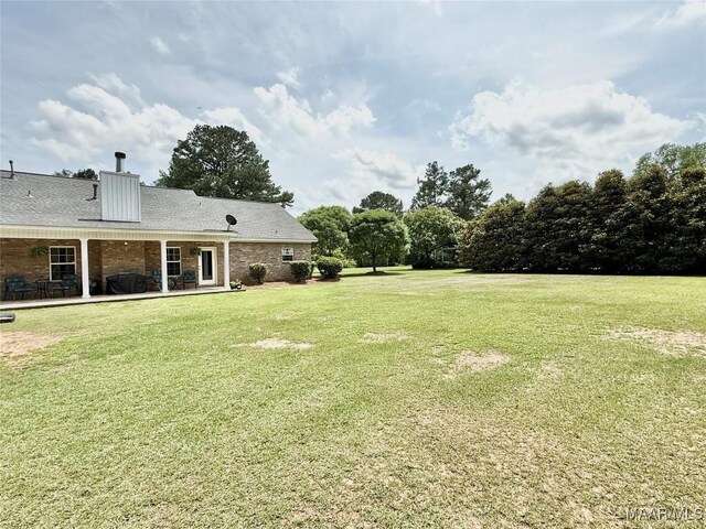 828 Warrior Dr, Valley Grande, AL 36701 - view of grassy yard with a patio