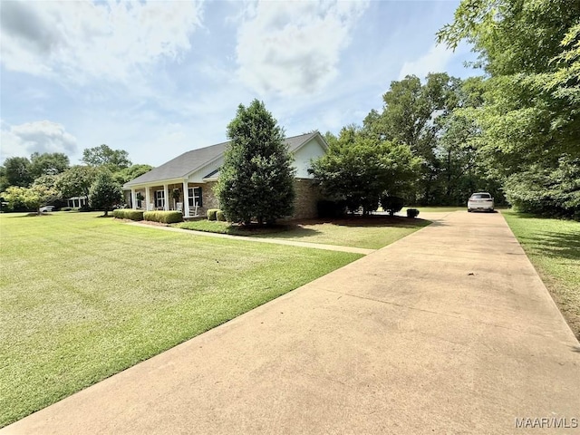 828 Warrior Dr, Valley Grande, AL 36701 - view of front of home featuring concrete driveway and a front lawn