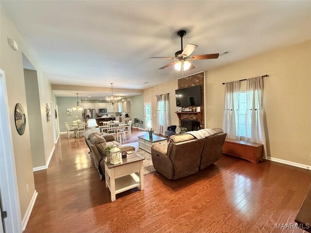 828 Warrior Dr, Valley Grande, AL 36701 - living room with a ceiling fan, healthy amount of natural light, wood finished floors, and baseboards