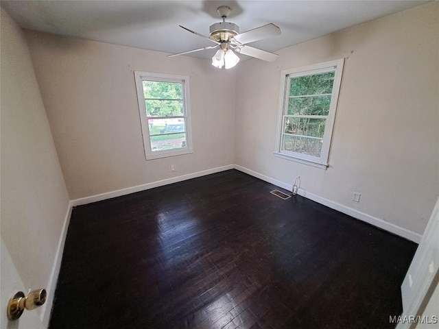 1960 Yarbrough St, Montgomery, AL 36110 - unfurnished room with dark wood finished floors, baseboards, and a ceiling fan