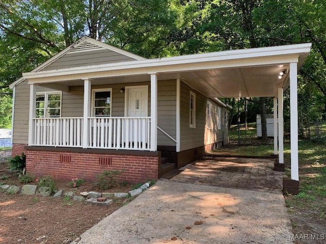 1960 Yarbrough St, Montgomery, AL 36110 - view of front of house featuring driveway, covered porch, an attached carport, and crawl space