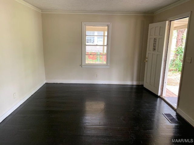 1960 Yarbrough St, Montgomery, AL 36110 - unfurnished room with healthy amount of natural light, dark wood-type flooring, baseboards, crown molding, and a textured ceiling
