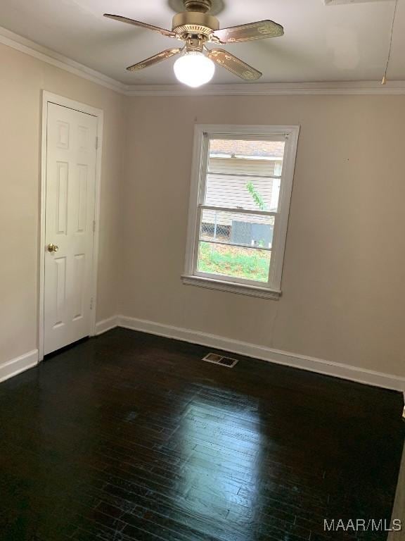 1960 Yarbrough St, Montgomery, AL 36110 - spare room featuring dark wood-style floors, ornamental molding, baseboards, and ceiling fan