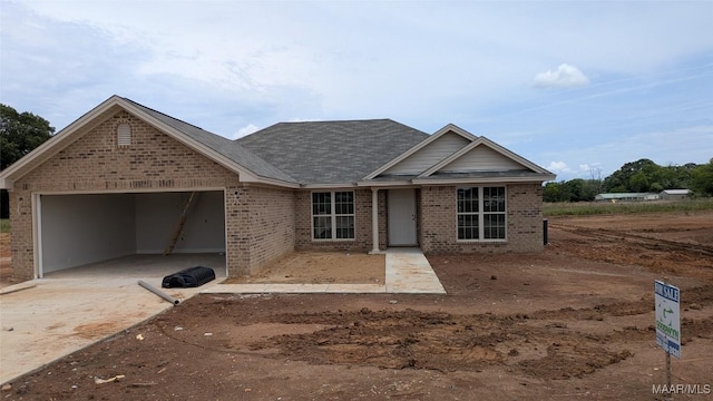 2634 Landing Way, Deatsville, AL 36022 - view of front of house featuring an attached garage, driveway, and brick siding