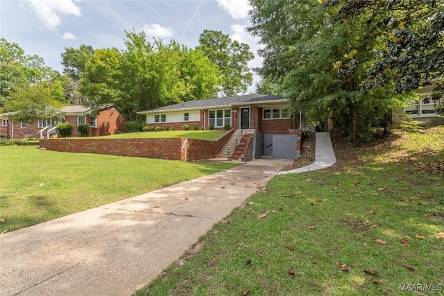 3468 Biltmore Ave, Montgomery, AL 36109 - single story home with concrete driveway, a front lawn, and brick siding