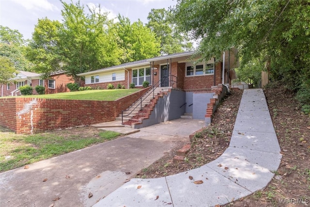 3468 Biltmore Ave, Montgomery, AL 36109 - single story home with brick siding, a front lawn, and stairway