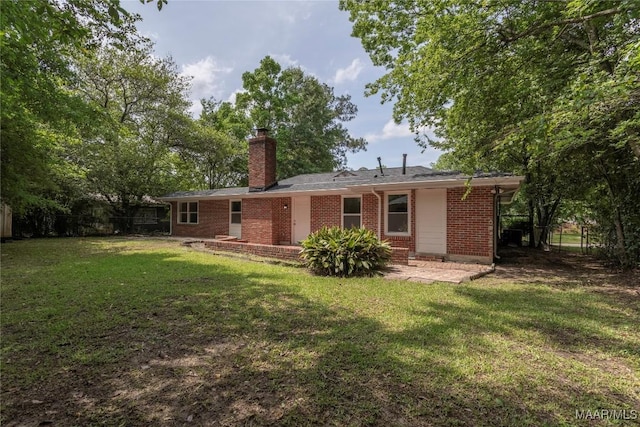 3468 Biltmore Ave, Montgomery, AL 36109 - back of house with brick siding and a chimney