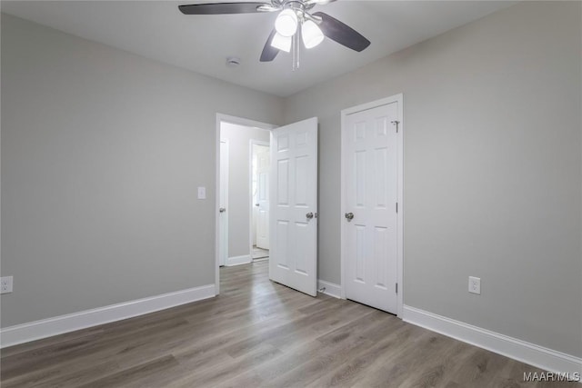 3468 Biltmore Ave, Montgomery, AL 36109 - unfurnished bedroom featuring wood finished floors, baseboards, and a ceiling fan
